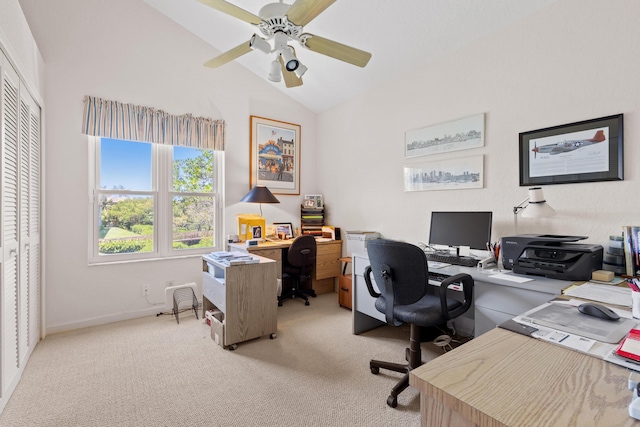 office area featuring ceiling fan, lofted ceiling, and light carpet