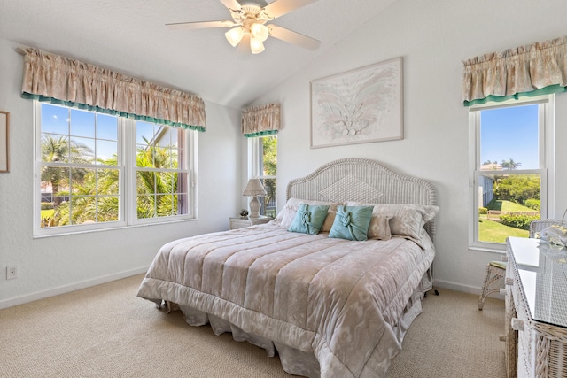 carpeted bedroom featuring vaulted ceiling and ceiling fan