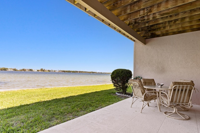 view of patio / terrace with a water view