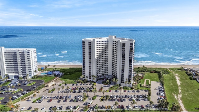 drone / aerial view featuring a view of the beach and a water view