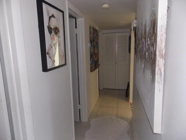 hallway with light tile patterned flooring