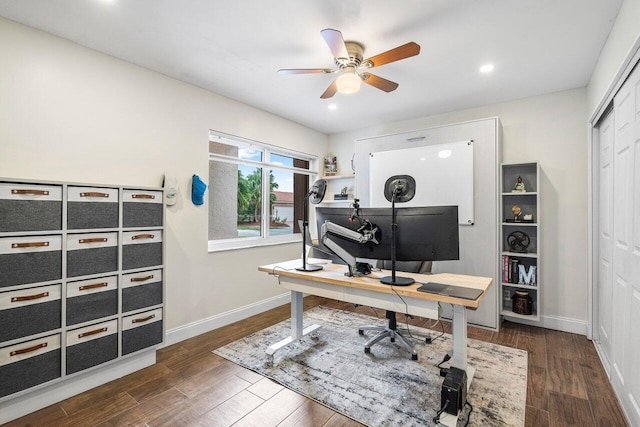 office with ceiling fan and dark hardwood / wood-style flooring