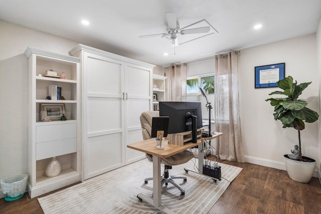 office area with dark wood-type flooring and ceiling fan