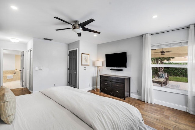 bedroom with ensuite bathroom and ceiling fan