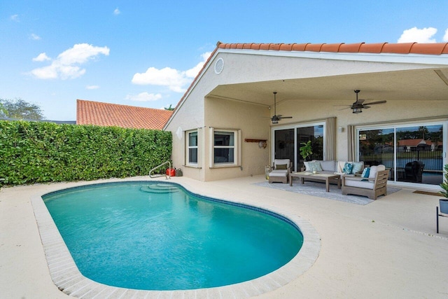 view of swimming pool featuring a patio area, ceiling fan, and outdoor lounge area