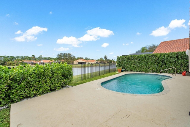 view of swimming pool featuring a patio area and a water view