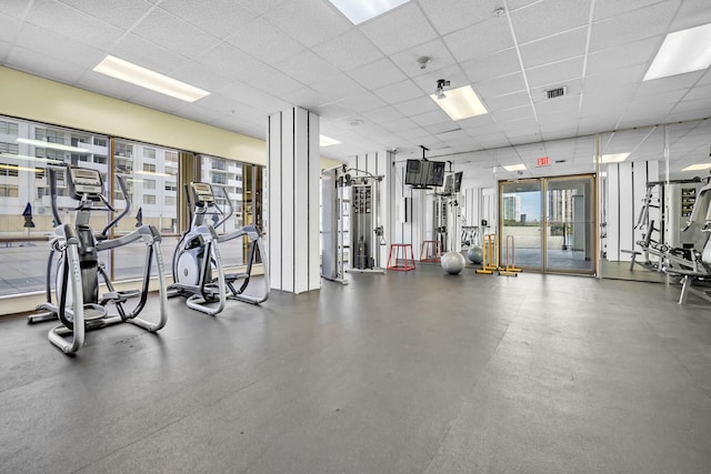 exercise room featuring a paneled ceiling