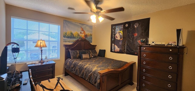 bedroom with a textured ceiling, multiple windows, and light carpet