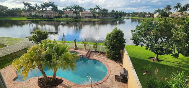 view of pool featuring a fenced in pool, a water view, a fenced backyard, and a jacuzzi