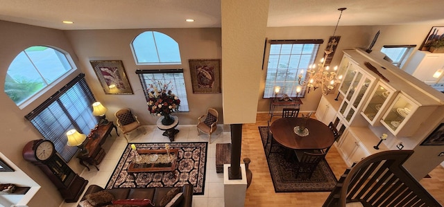 living room with recessed lighting, wood finished floors, and plenty of natural light