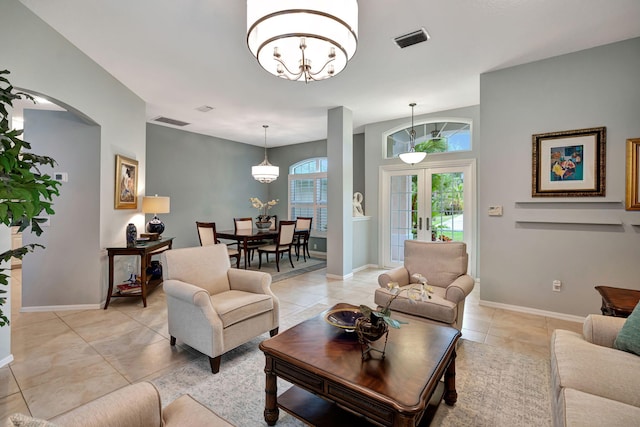 living room with light tile patterned flooring and french doors