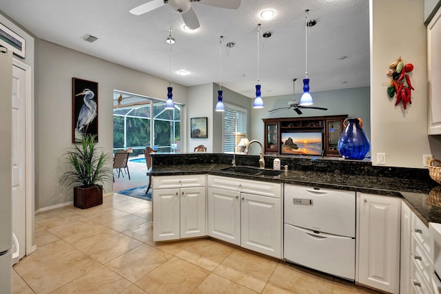 kitchen with white cabinetry, ceiling fan, sink, and hanging light fixtures