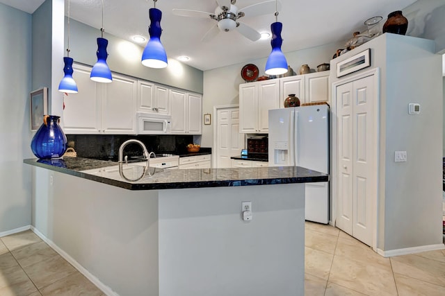 kitchen featuring white cabinetry, light tile patterned floors, kitchen peninsula, white appliances, and decorative backsplash