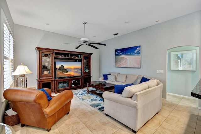 living room featuring light tile patterned floors and ceiling fan