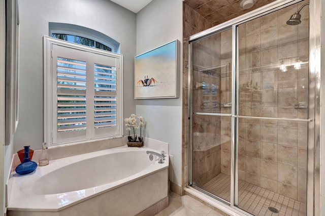 bathroom with independent shower and bath, a healthy amount of sunlight, and tile patterned floors