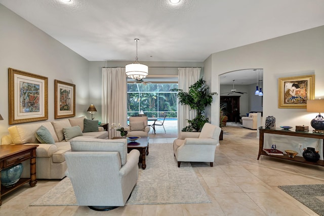 living room featuring light tile patterned floors and a textured ceiling