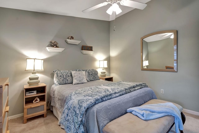 bedroom with ceiling fan and light colored carpet