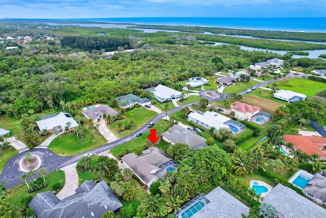 birds eye view of property featuring a water view