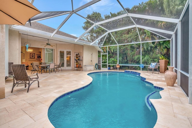 view of pool with a lanai, a patio area, and ceiling fan