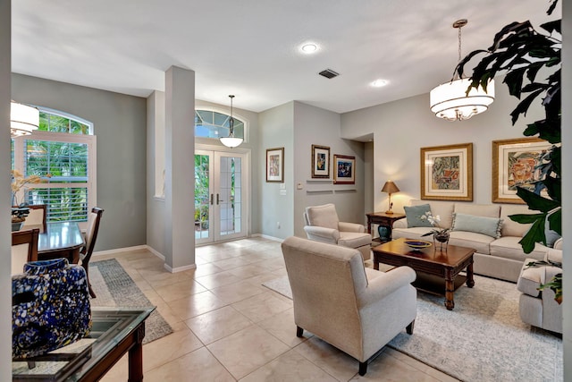 living room with light tile patterned floors and french doors