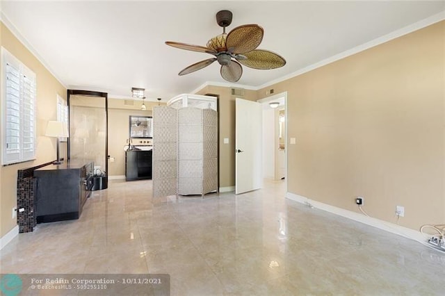 unfurnished living room featuring ornamental molding, visible vents, baseboards, and a ceiling fan