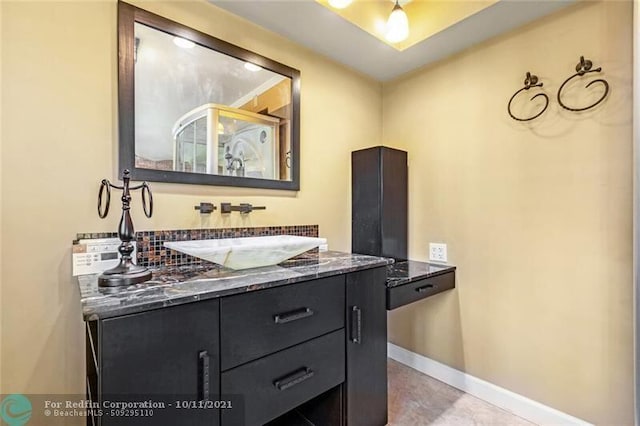 bathroom featuring vanity and baseboards