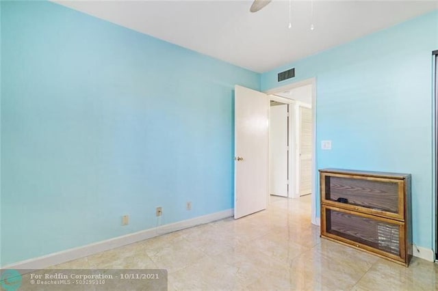 unfurnished bedroom with visible vents and baseboards