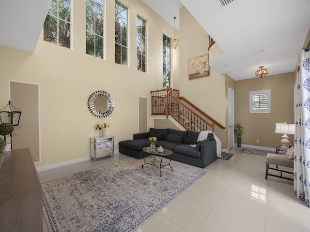 tiled living room with a towering ceiling