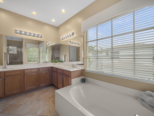 bathroom with vanity, separate shower and tub, and tile patterned floors