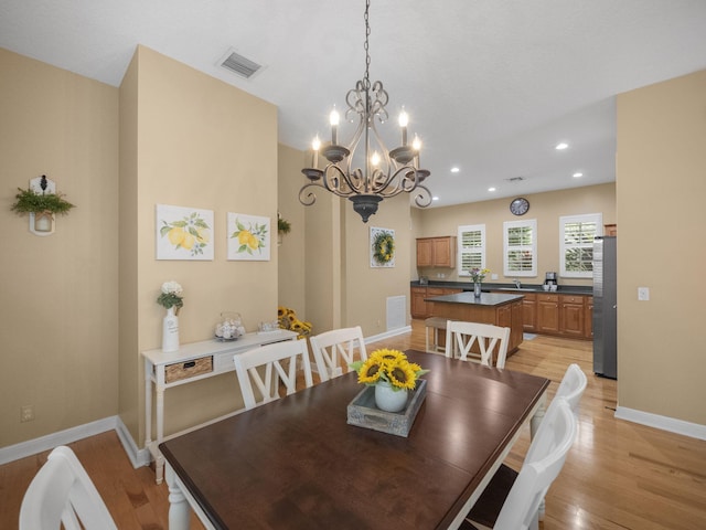 dining room featuring light hardwood / wood-style flooring