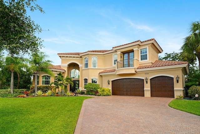 mediterranean / spanish home featuring a front yard, a garage, french doors, and a balcony