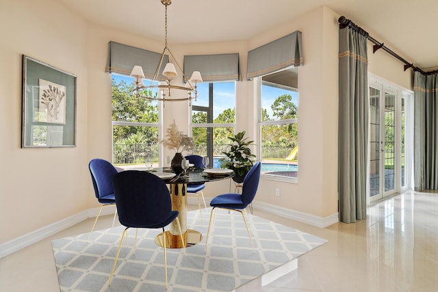 tiled dining area with a healthy amount of sunlight, french doors, and a chandelier