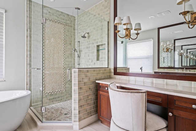 bathroom featuring independent shower and bath and vanity