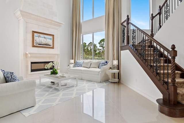 tiled living room with a towering ceiling