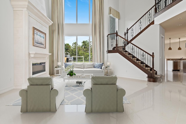 living room with a towering ceiling