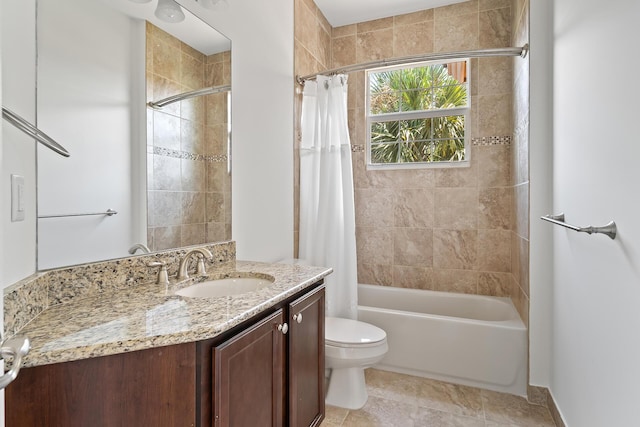 full bathroom featuring toilet, vanity, and shower / bathtub combination with curtain