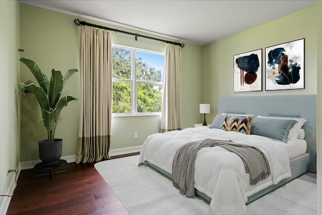 bedroom with hardwood / wood-style floors