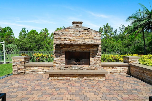 view of patio / terrace with an outdoor stone fireplace