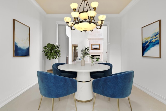 dining room with ornamental molding and a notable chandelier