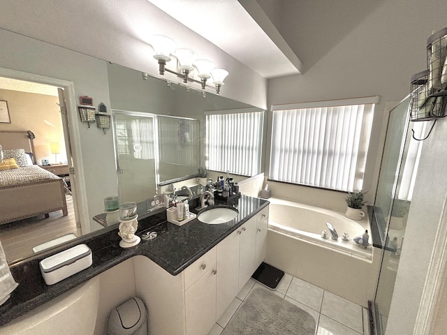 bathroom featuring vanity, plus walk in shower, and tile patterned flooring