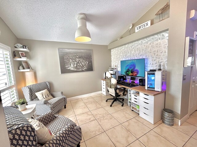 office with a textured ceiling, light tile patterned floors, and lofted ceiling