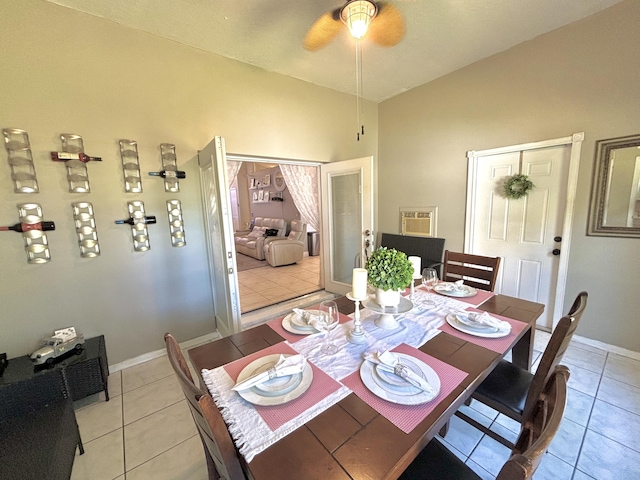 dining space featuring ceiling fan and light tile patterned flooring