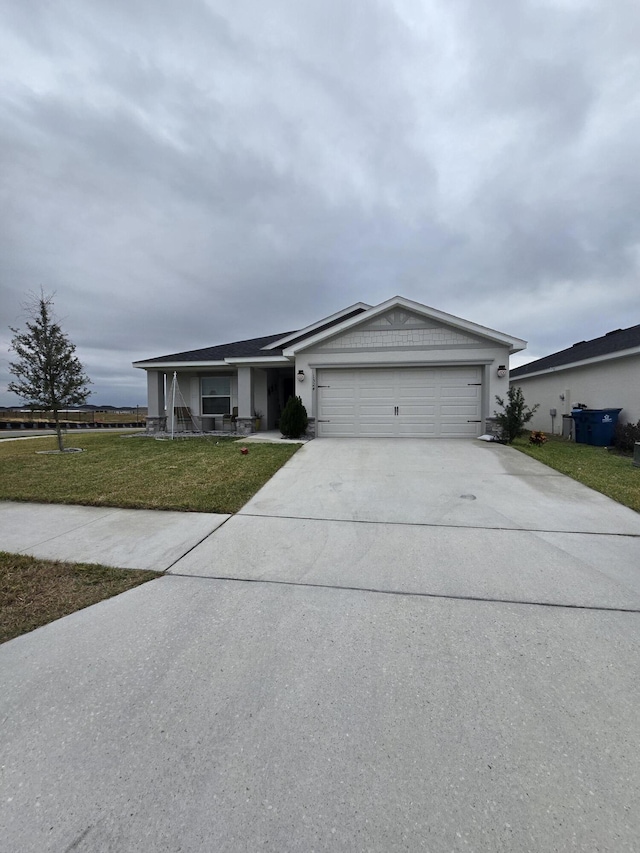 ranch-style home with a garage and a front yard