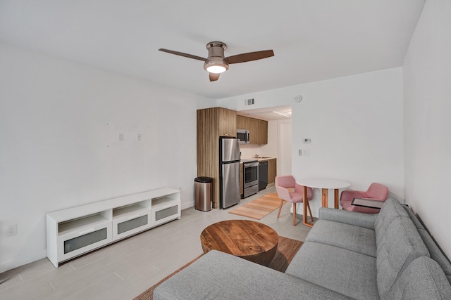 living room featuring ceiling fan