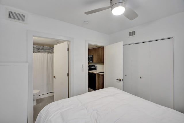 bedroom with ensuite bath, a closet, ceiling fan, and light wood-type flooring