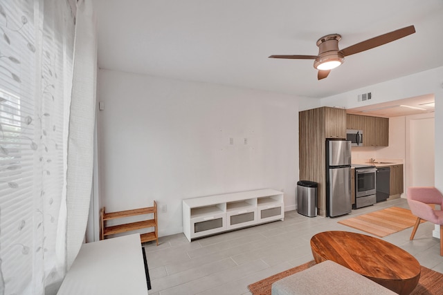 living room with ceiling fan