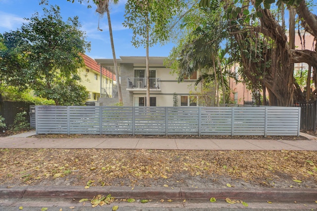 view of front of house with a balcony