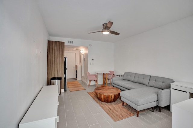 living room with ceiling fan