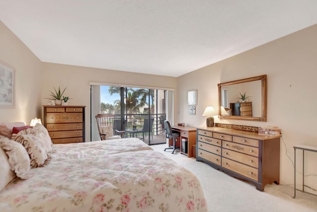 bedroom featuring access to exterior and light carpet