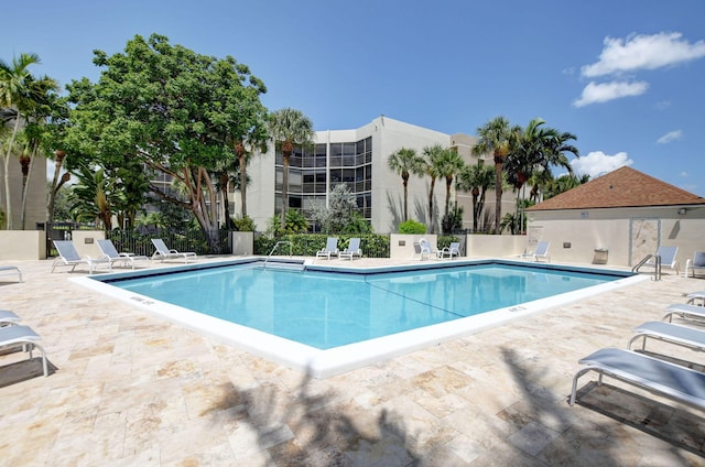 view of swimming pool with a patio